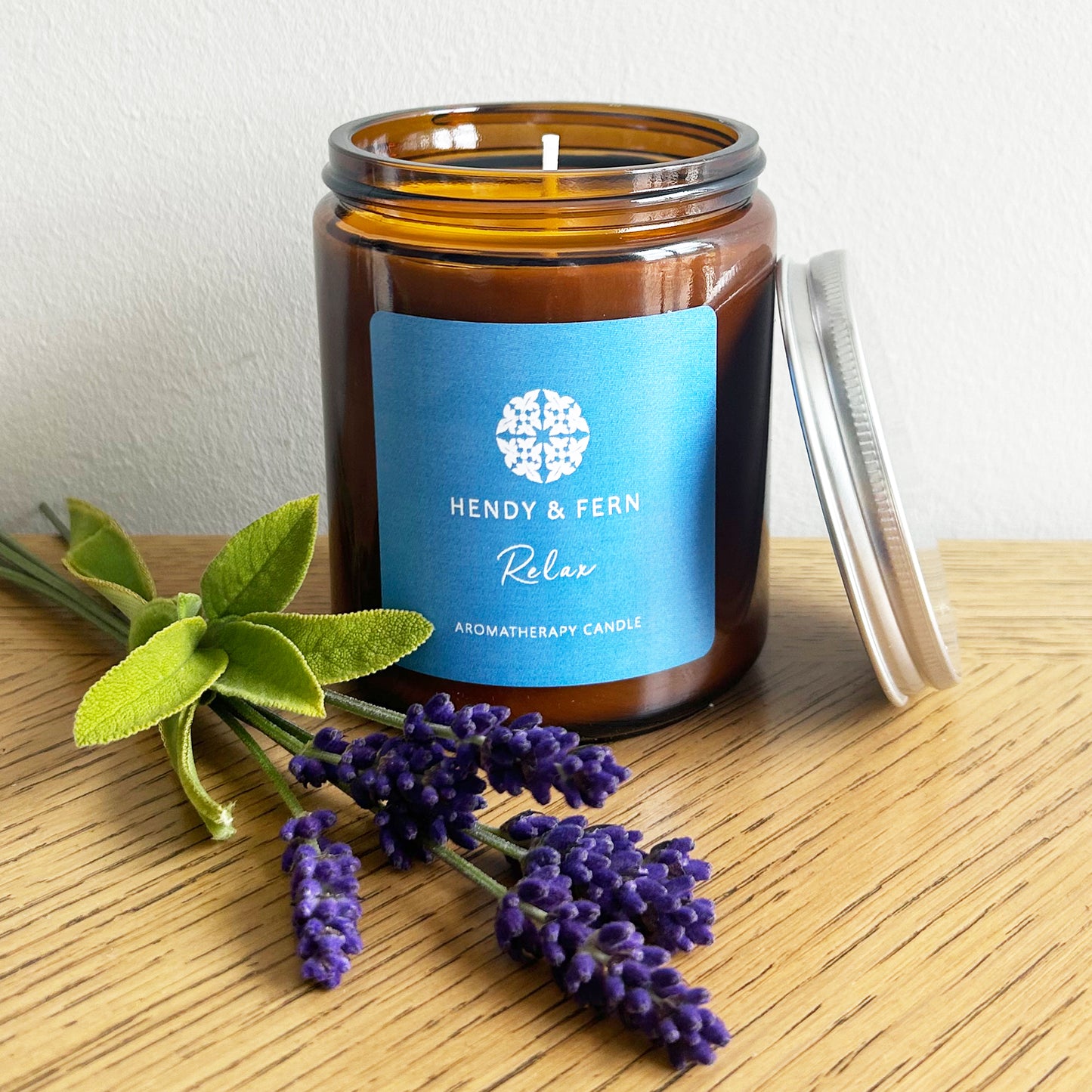 200g aromatherapy soy candles in an amber glass jar with lavender and sage sprigs.
