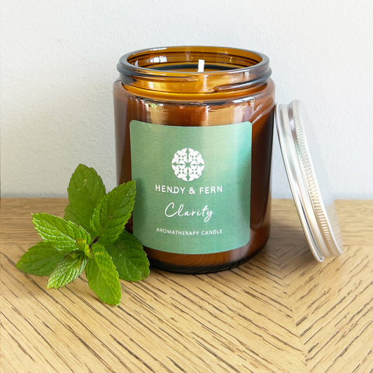 200g aromatherapy soy candles in an amber glass jar with wild mint sprig.