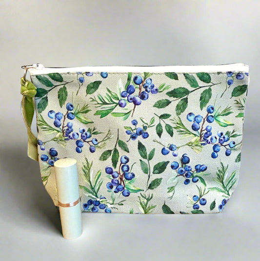 berry print toiletry bag with lipstick for scale